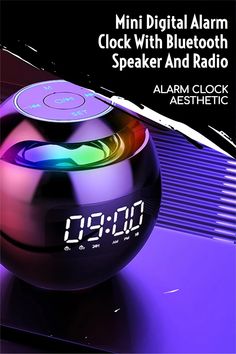 an alarm clock sitting on top of a purple ball with the words, clock with bluetooth speaker and radio