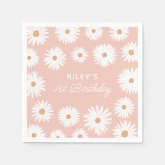 a pink and white birthday napkin with daisies on it