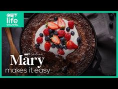 a cake with berries and cream on top is featured in this ad for mary makes it easy