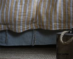 a suitcase sitting next to a bed with a rope on the bottom and side rails