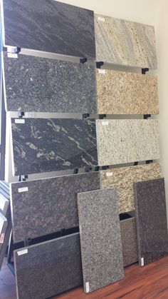 several different types of granite on display in a store