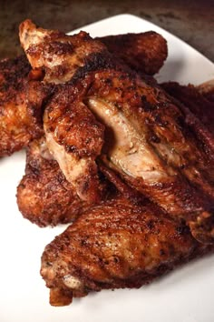 chicken wings on a white plate ready to be eaten