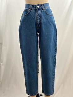 These 90s Cabela's jeans are the basic denim you need.  High waisted, they have a slight tapered leg with a mom fit and a medium wash.  Pair with a blazer and oxford shoe. -Vintage 90s -Medium wash, high waist -Machine wash recommended  Measurements: *Waist 12 1/2 inches *Rise 11 1/4 inches *Hips 17 1/2 inches *Inseam 27 1/2 inches *Length 37 1/2 inches *This item is pre-loved and there may be minor flaws to the garment. Not to worry if there is anything major we will let you know. --Please read shop policies thoroughly relating to sizing, returns will not be accepted. I encourage you to ask questions for additional pictures, measurements, etc.-- Oxford Shoe, Jeans High Waisted, Jeans Mom, Medium Wash Jeans, Washed Jeans, Wash Jeans, High Waisted Denim, High Jeans, High Waist Jeans