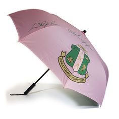 a pink umbrella with the coat of arms and motto on it is opened to show an autographed image