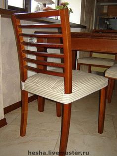 a wooden chair sitting in front of a table