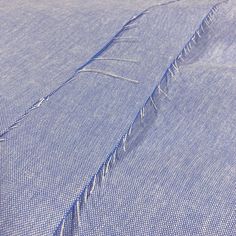 an image of a blue shirt that is not in the folds or has been stitched together