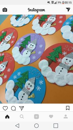 snowmen and trees made out of paper plates on an orange tablecloth with the words instagram