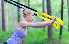 a woman holding two yellow arrows in her hands with the words, 7 amazing trx moves