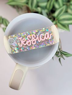 a cup that has some kind of sticker on it with the word sessa