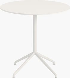 a white round table with four legs and a circular top, viewed from the front