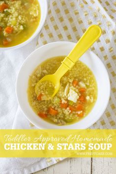 two bowls of chicken and stars soup with a yellow spoon in them on a table