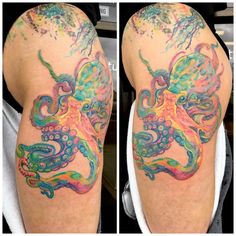 an octopus tattoo on the back of a man's left arm, with multicolored ink