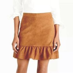 Nwot Excellent Condition, No Flaws! Us Women’s Size 2 J Crew Tan Faux Suede Skirt With Frill Hemline J. Crew Faux-Suede Ruffled Mini Skirt In Warm Carmel Brown J. Crew Style K2161 Ultra Soft And Smooth Suede Fabric Golden Brown Color Ruffle Trim Along Bottom Hem Mermaid Style Mini Sits At Waist Length: Approximately 16” Falls Above Knee Concealed Back Zip Closure Fully Lined Material: 100% Polyester Dry Clean. Classic, Chic, And Versatile Skirt Perfect For Any Occasion From Office Work To Partie Brown Tiered Skirt For Fall, Brown Tiered Skirt Bottoms For Fall, Brown Ruffled Skirted Bottoms, Brown Ruffled Skirt Bottoms, Brown Skirted Bottoms With Ruffled Detail, Beige Ruffle Skirt For Fall, Brown Skirted Bottoms With Ruffled Skirt, Fall Ruffled Beige Skirt, Chic Ruffle Hem Skirt For Fall