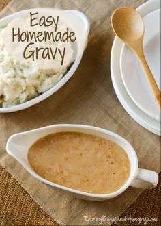 homemade gravy in white bowls with wooden spoons and plate on brown table cloth