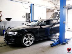 a car being worked on in a garage