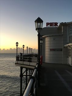 the pier is next to an empty building with a sign that says pier on it