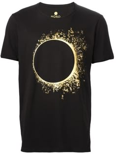 a black t - shirt with gold paint splattered on the front and side