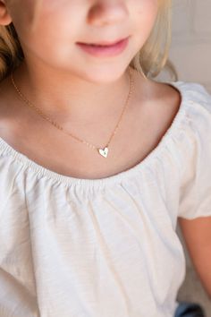 A super cute flower girl heart pendant initial necklace.  This adorable initial necklace makes the perfect personalized gift for any girl, any age!  You'll love the look of excitement in their eye as they open their very own custom heart initial necklace!  A perfect "thank you" for them being a part of your special day.It's simple, classic design will be popular and trendy for many years to come.  Each matte gold or silver initial heart charm is strung from a sturdy diamond-cut chain.  Strong en White Necklace With Heart Charm For Birthday, Birthday Heart Charm Necklaces With Initial Pendant, Dainty Heart Charm Necklace For Birthday, White Heart Necklace With Charm For Birthday, Cute Personalized Heart Necklace For Mother's Day, Dainty Initial Necklace For Birthday Or Valentine's Day, Cute Heart Pendant Necklace For Birthday, Birthday Jewelry With Heart Charm And Initial Pendant, Dainty Initial Necklace For Birthday On Valentine’s Day