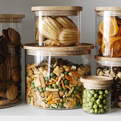 several jars filled with different types of food