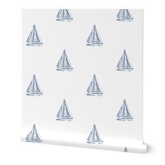 a white wall with blue sailboats on it