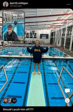 a young boy standing on the edge of a swimming pool with his arms in the air