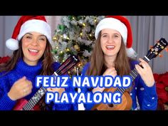 two women in santa hats are holding guitars and playing the ukulele song, which reads feliz navidad playalong