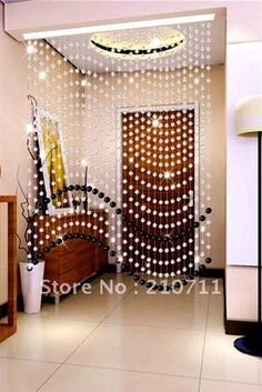 the room is decorated with beads and lights