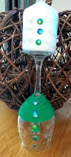 a wine glass sitting on top of a wooden table