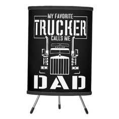 a black can holder with the words, my favorite trucker calls me dad