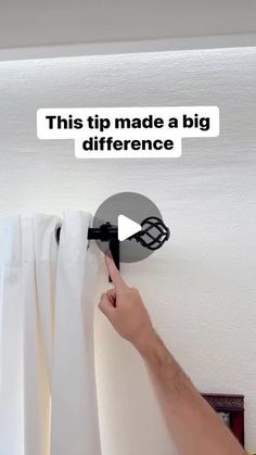 someone is pulling curtains off the wall with their hand and pointing at it that says, this tip made a big difference