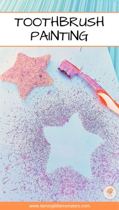 toothbrush painting with pink and purple colors on it, next to a star shaped object