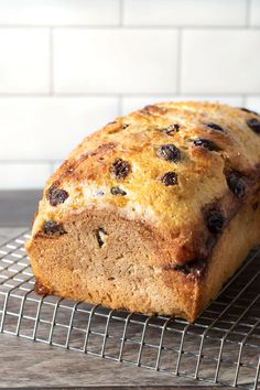 a loaf of bread sitting on top of a cooling rack