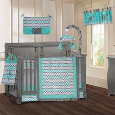 a baby crib bedding set with blue and gray chevrons