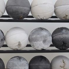 there are many balls that have been placed on the shelves