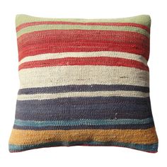 a multicolored striped pillow on a white background