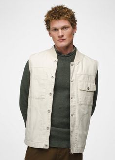 This workwear-inspired vest is built with organic cotton canvas and has a flannel lining for extra warmth. Cotton Vest With Pockets For Workwear, Cotton Workwear Vest With Pockets, Cotton Work Vest With Pockets, Khaki Cotton Utility Vest, Khaki Cotton Outerwear For Layering, Outdoor Cotton Vest With Patch Pockets, Khaki Cotton Vest Outerwear, Cotton Vest With Pockets For Fall, Fall Cotton Vest With Pockets