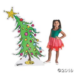 There’s no mistaking the iconic wonky Christmas Tree from The Grinch! Add this stand-up decoration to your party supplies for a Grinch Christmas party ... Grinch Photo Backdrop, Dr Seuss Christmas Tree, Christmas Tree Cardboard, Whoville Christmas Tree, The Grinch Christmas Tree, Whoville Tree, Tree Cardboard, Dr Seuss Decorations, Grinch Door