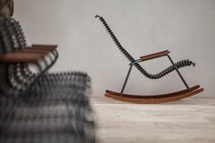 a rocking chair sitting on top of a wooden floor