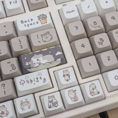 a computer keyboard with some stickers on it