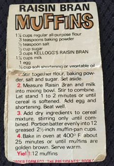 the label for raisin bran muffins on a black cloth with white writing