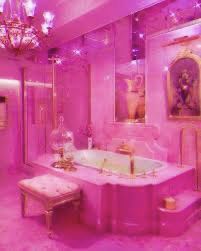 a pink bathroom with chandelier, tub and vanity in the corner is lit by purple lights