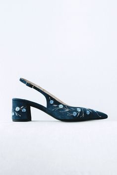 Wedding slingback pumps 'Tati' are handcrafted from navy blue Italian suede. The pair of bridal heels features handmade floral embroidery with flowers and vines that can be customized to your preference.  This design also has pointy toes and a 5.5 cm / 2.2 inches stable block heel. The heel also has the embroidery on all sides in the same pattern. These wedding shoes are designed with a V-notched vamp (v-cut) and closed toe which makes bridal sandals even more elegant and special. Take note that Elegant Formal Heels With Floral Embroidery, Elegant Floral Embroidered Heels For Formal Occasions, Elegant Floral Embroidery Heels For Formal Occasions, Evening Heels With Floral Embroidery And Pointed Toe, Evening Heels With Floral Embroidery And Closed Toe, Floral Embroidered Heels For Evening With Closed Toe, Formal Heels With Floral Embroidery And Pointed Toe, Formal Floral Embroidered Pointed Toe Heels, Formal Heels With Floral Embroidery And Ankle Strap