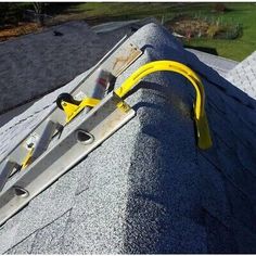 a yellow hose is attached to the roof of a house