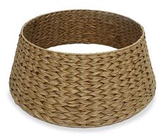 a large round basket is shown on a white background, with the bottom section partially covered in wicker