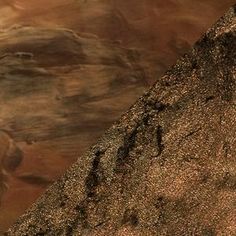 an image of a mountain side with rocks and water in the foreground, as seen from above