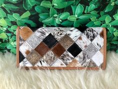 "Custom Patchwork Cowhide Wallets for Women Slim Wallet Bifold Brown Black Leather Real Cow Hide - Gifts for Her This listing is for a beautiful slim wallet designed in genuine hair on cow hide. The wallet features patchwork design made out of mixed color of real cowhide hair on. A leather trim is added to finish the look. The wallet helps you stay organized with an ample selection of pockets inside smooth, refined calf leather. Measures 7.5\" (L) x 3.5\" (W) Snap Closure 11 credit card slots 3 Western Patchwork, Cowhide Purse, Black Leather Clutch, Slim Wallet, Designer Gifts, Patchwork Designs, Clutch Wallet