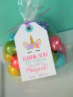 a bag filled with lots of colorful candies next to a tag that says thank you for making my party magical