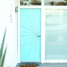 a blue front door with the word hello on it