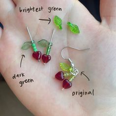 four different types of earrings on a person's hand with the words, highest green, dark green, and original