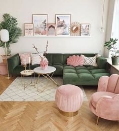 a living room filled with pink and green furniture